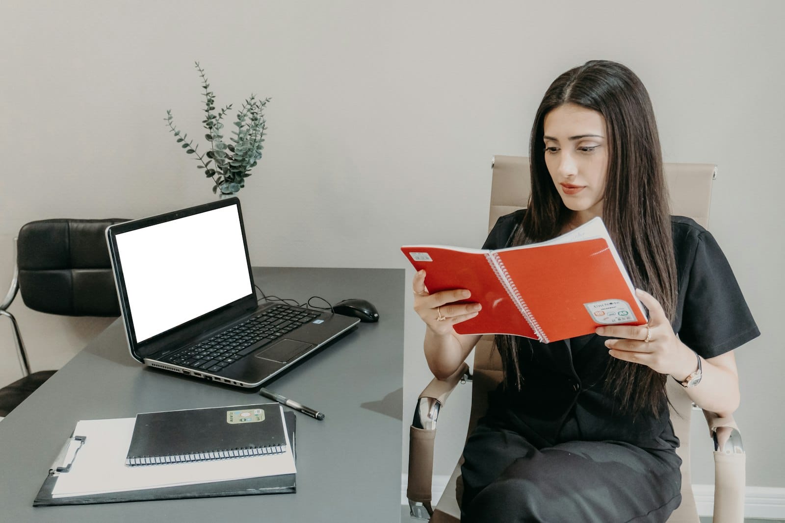 A professional reading a security audit document