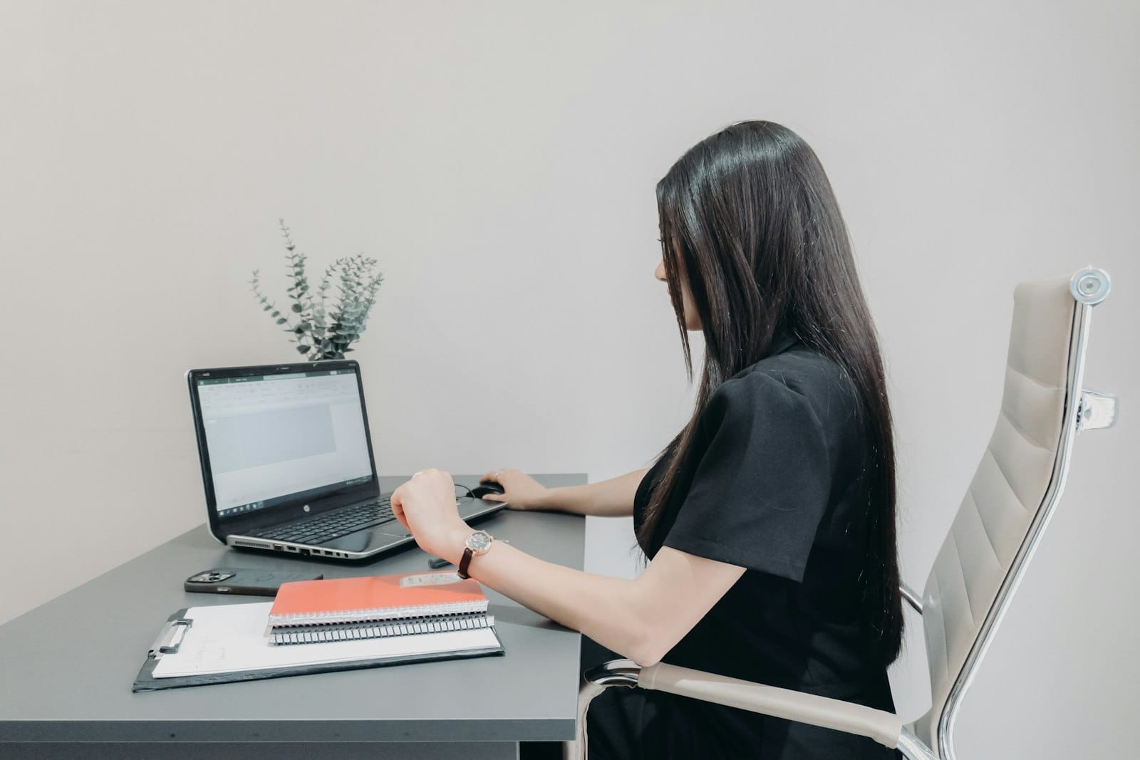 A small business owner working through her security tasks