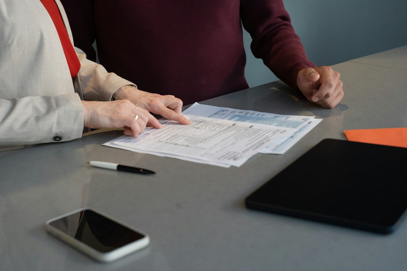 A small business team reviewing security documents together