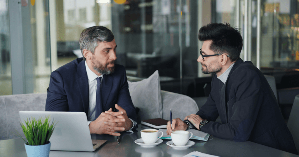 Two business owners weighing SOC 2 vs ISO 27001